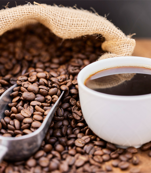 Coffee beans and cup of coffee